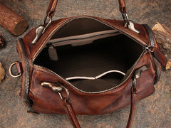 A brown textured leather handbag shown open